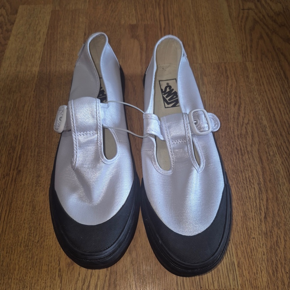 Vans Classic White and Black Slip-Ons